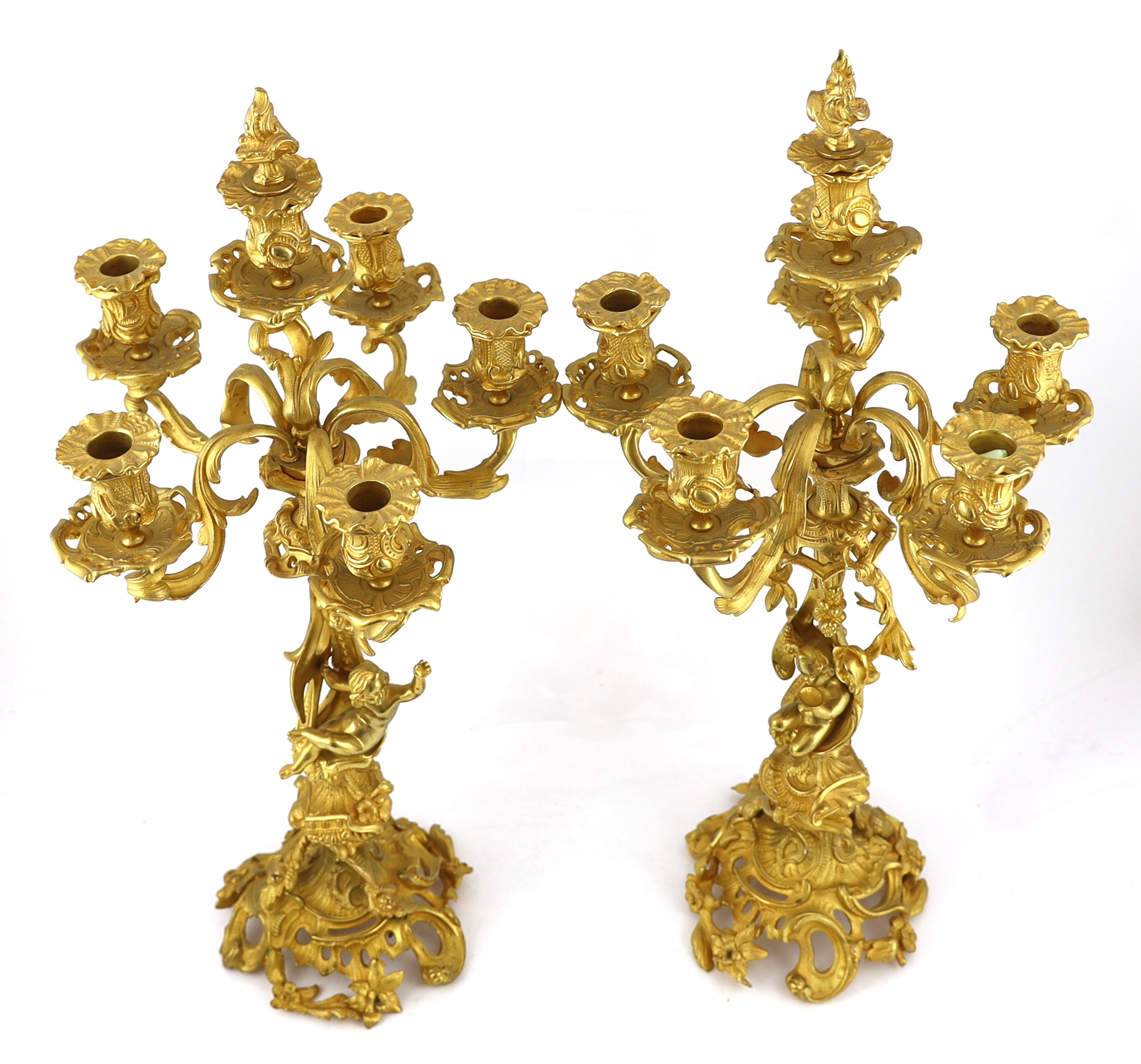 A pair of Victorian style ormolu six light candelabra 66cm high